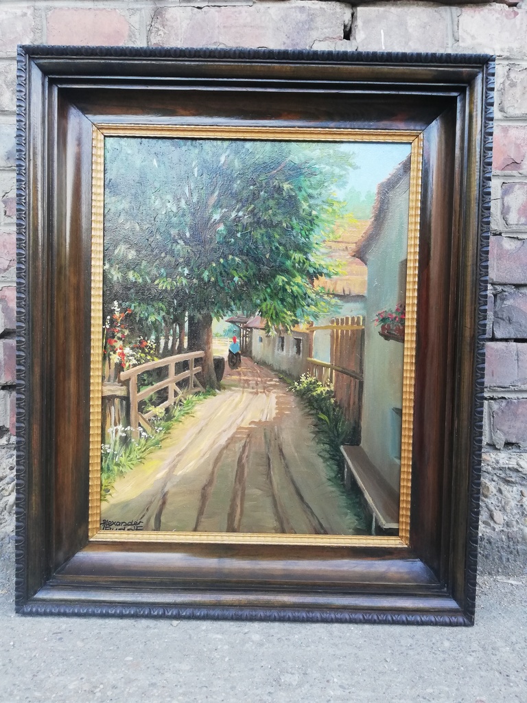 Dorfstraße mit riesigem Baum